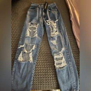 Ripped cut out blue wash oversized jeans